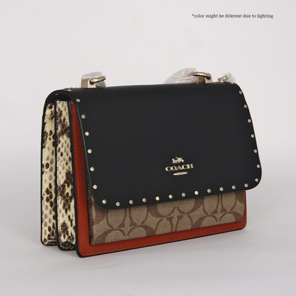 coach klare in signature canvas with rivets