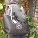 coach city tote in signature canvas with varsity motif