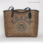 coach city tote signature canvas with varsity motif