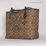coach city tote signature canvas with varsity motif