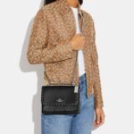 coach klare crossbody in signature canvas with rivets