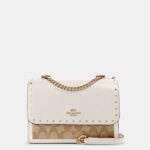 coach klare crossbody in signature canvas with rivets