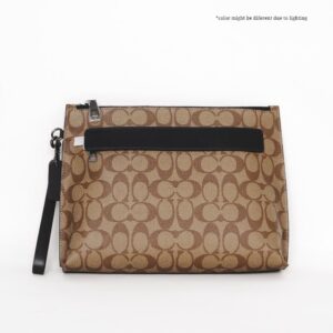 coach carryall pouch in signature canvas