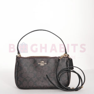 coach top handle pouch in signature canvas