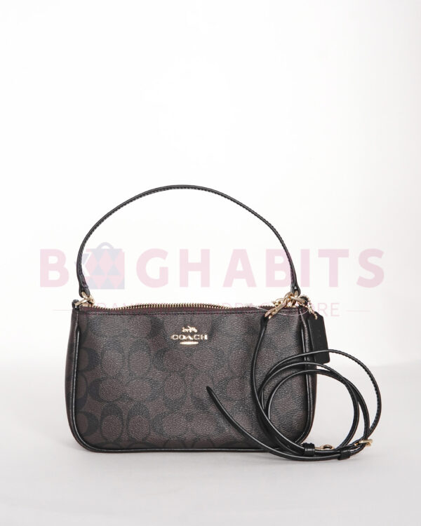 coach top handle pouch in signature canvas