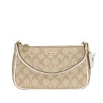 coach top handle pouch in signature canvas
