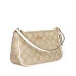 coach top handle pouch in signature canvas
