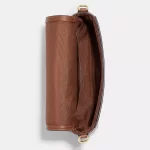 coach logan messenger in signature canvas