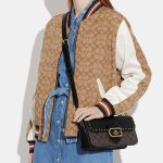 coach morgan shoulder bag in colorblock signature canvas with rivets