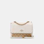 coach klare crossbody in signature canvas with rivets