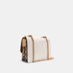 coach klare crossbody in signature canvas with rivets