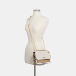 coach klare crossbody in signature canvas with rivets