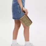 coach double zip wallet in signature canvas