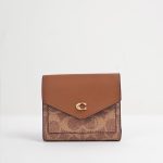 coach mila small flap wallet in signature canvas