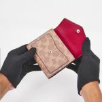 coach mila small flap wallet in signature canvas